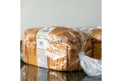Image Bread wrapped in plastic packaging and paper-based clips.
